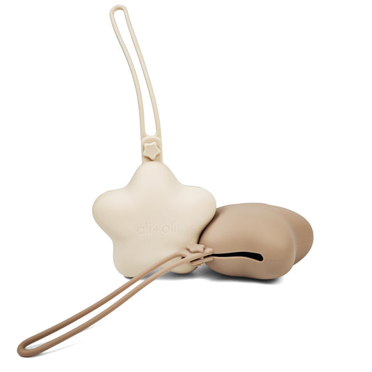 Star-shaped beige product with a strap on a white background