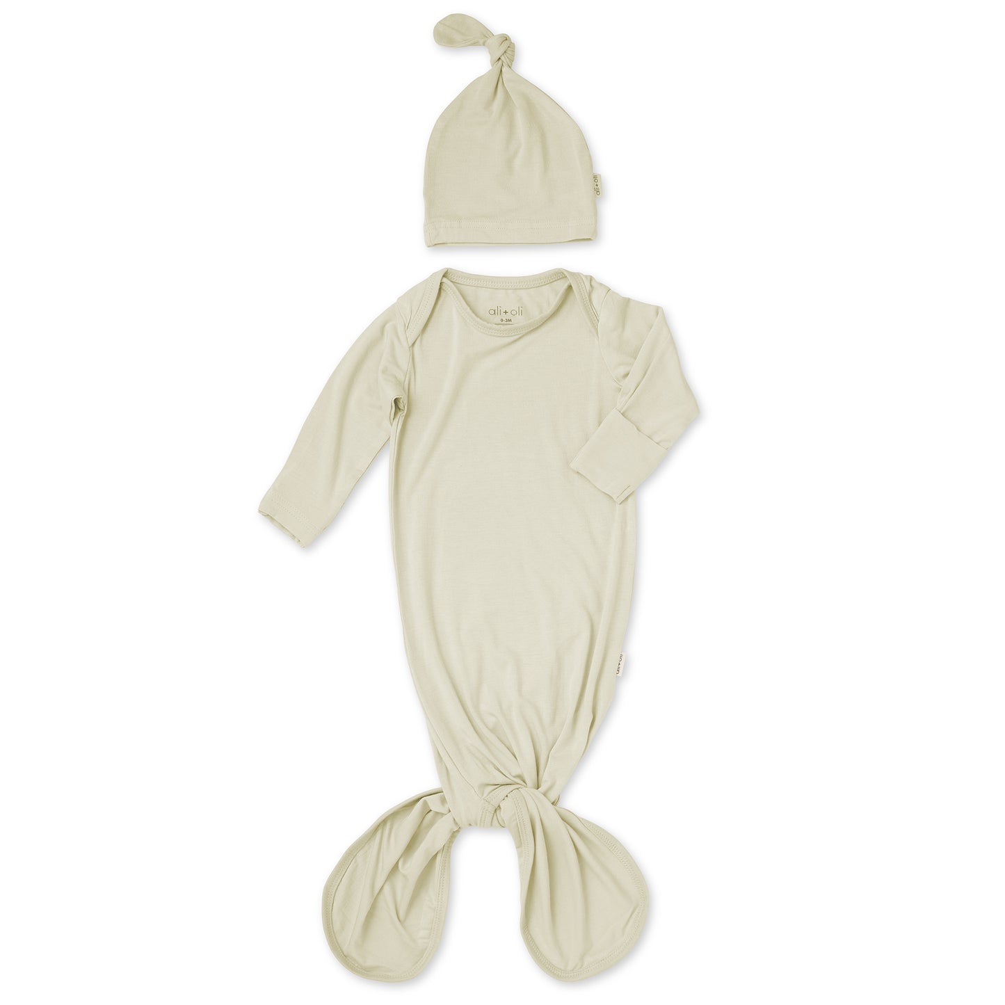 Beige baby wrap and hat set on a white background
