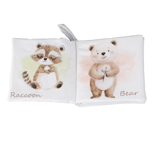 Children's soft book with illustrations of a raccoon and a bear on a white background