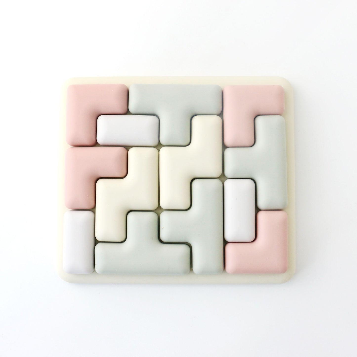 Geometric tile puzzle with pastel colors on a white background
