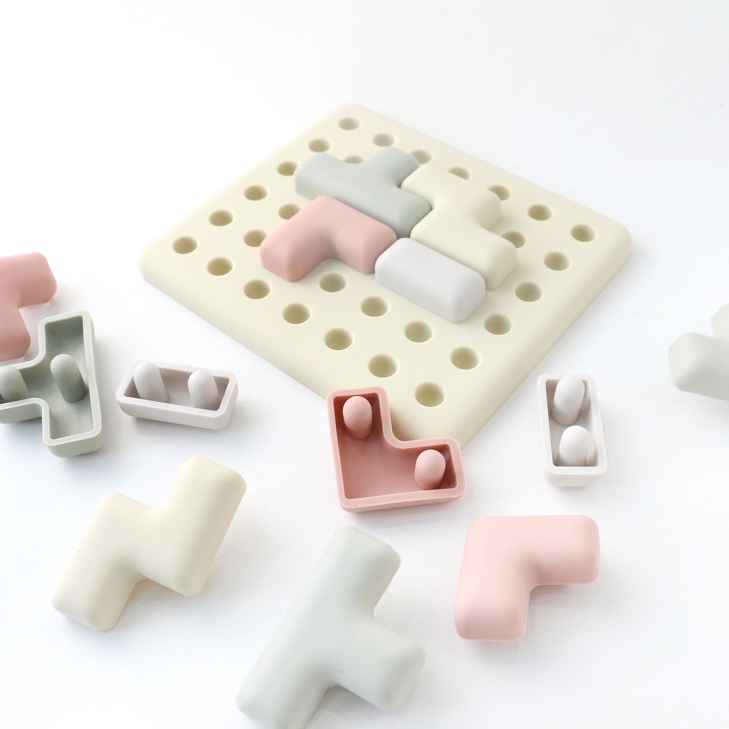 Set of colorful geometric silicone molds on a white background