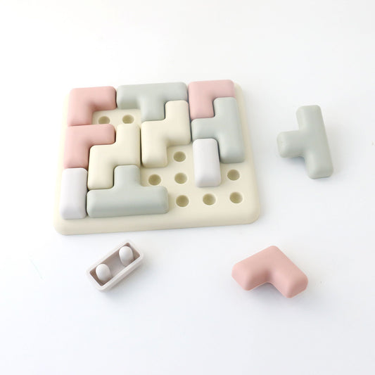 Colorful geometric puzzle toy on a white background
