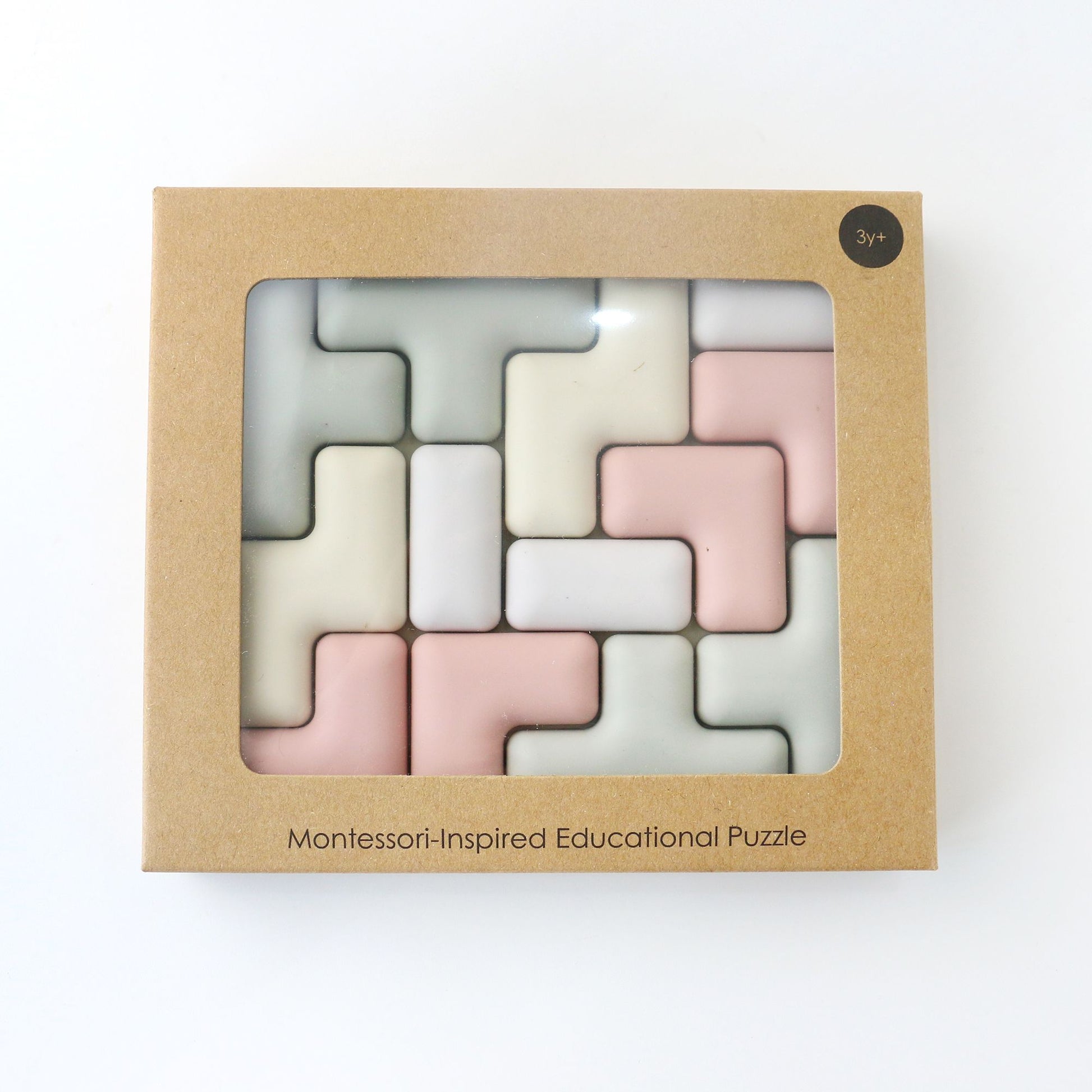 Montessori-inspired educational puzzle in a cardboard box on a white background