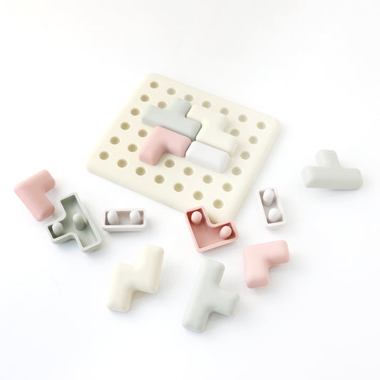 Set of colorful silicone letter-shaped molds on a white background