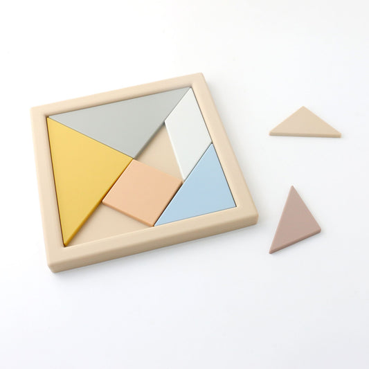 Set of geometric wooden puzzle pieces on a white background