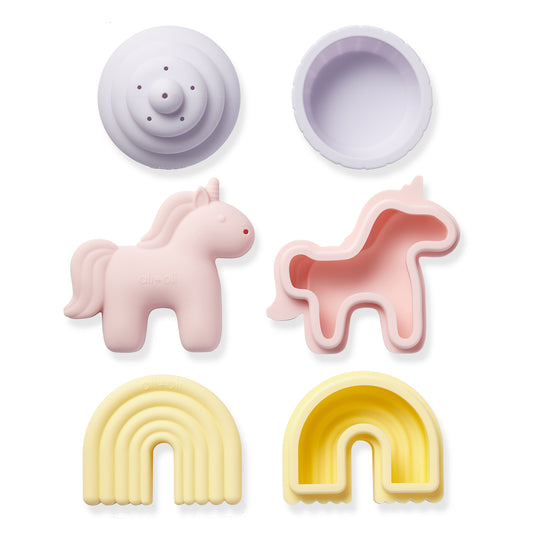 Set of colorful silicone molds including a unicorn, rainbow, and other shapes on a white background.
