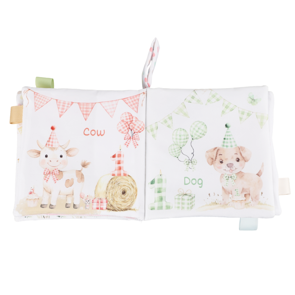 Children's soft book with animal illustrations on a white background