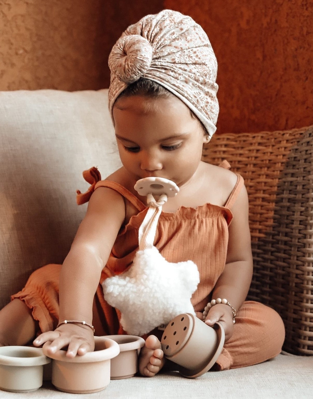 Baby Girls Playing with silicone stacking cups