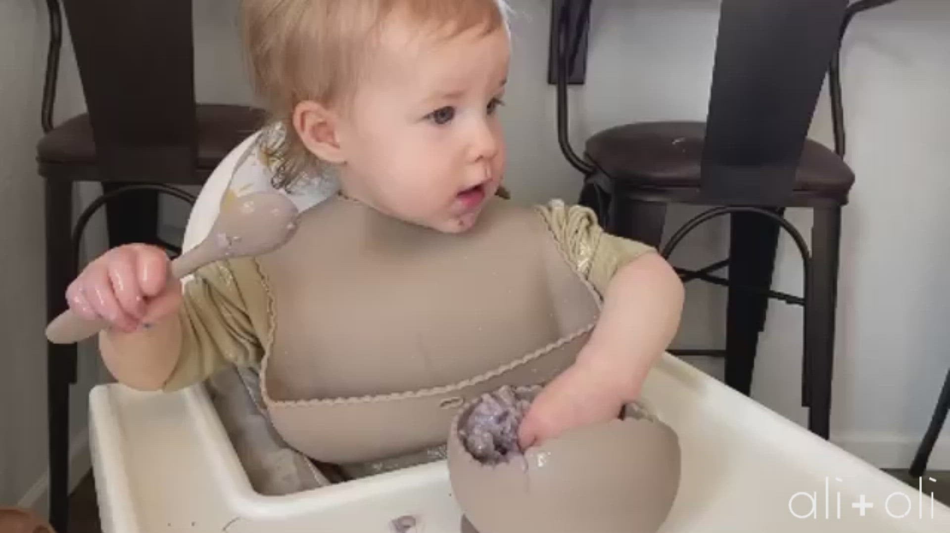 Baby eating silicone bowl and spoon