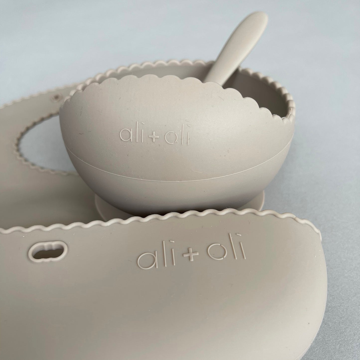 Ali+Oli Silicone Roll-Up Baby Bib (Taupe) Wavy Edge